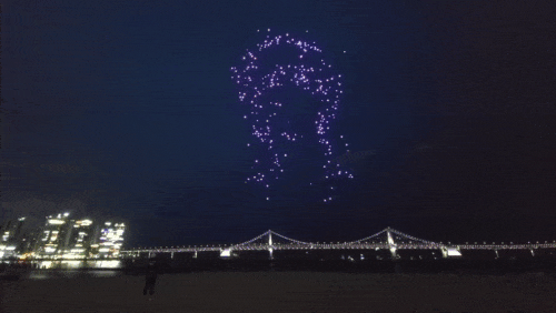 A dazzling drone show illuminates the night sky over Gwangandaegyo Bridge