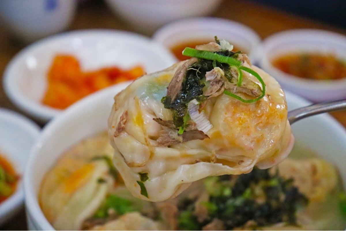 Dumplings and side dishes in dumpling soup