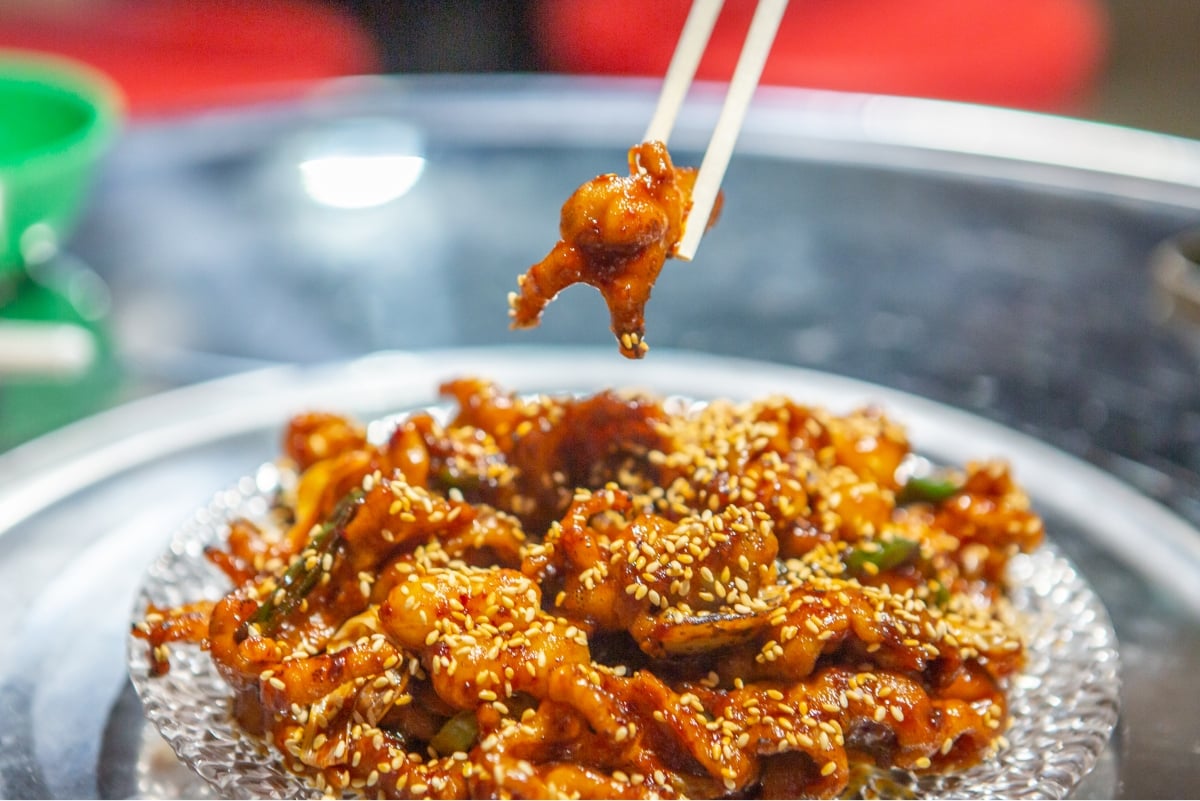 Chicken feet lifted with chopsticks