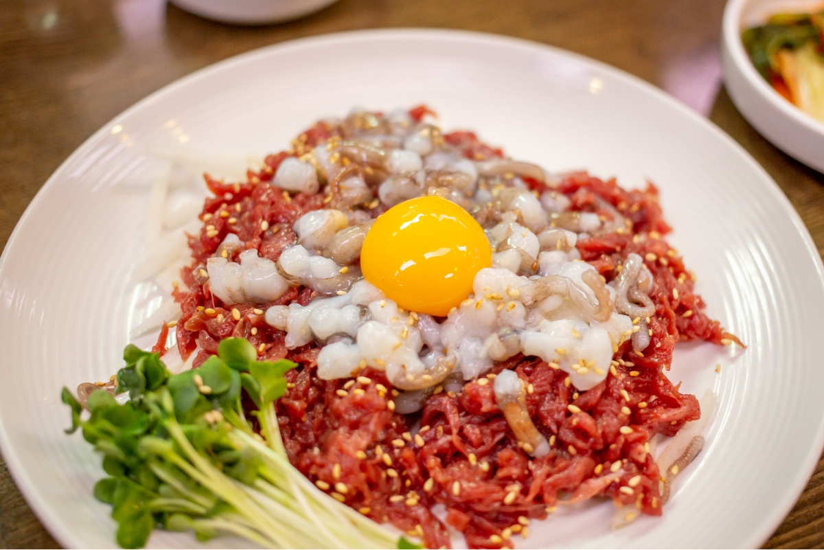 Live octopus yukhoe with egg yolk