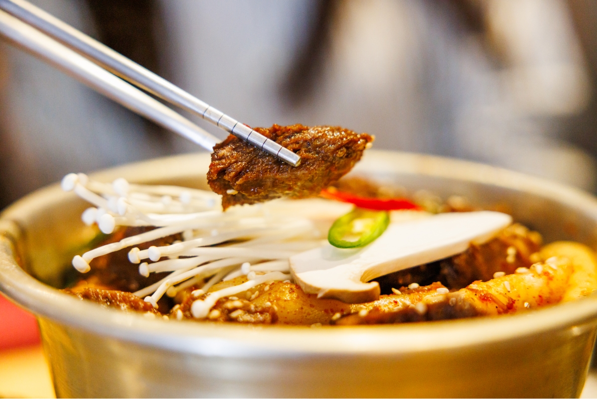 A picture of you lifting braised short ribs with chopsticks