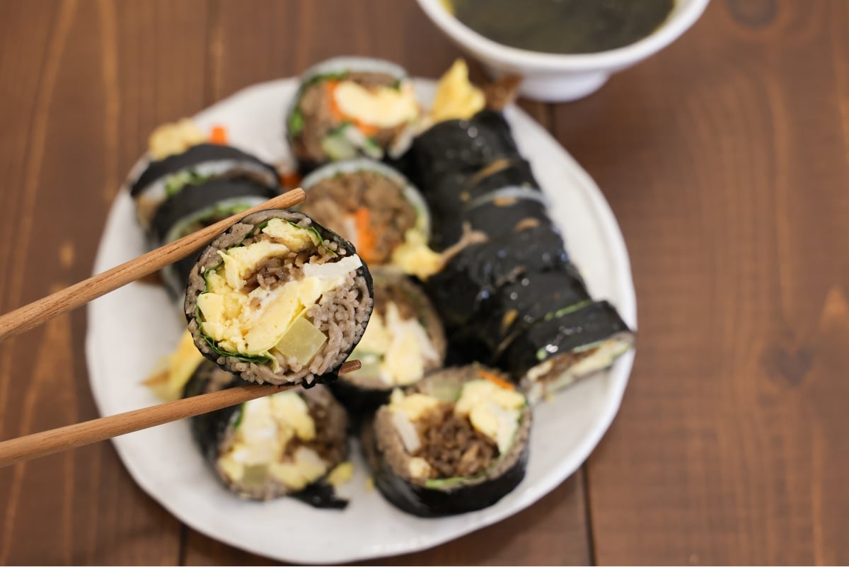 Buckwheat kimbap lifted chopsticks