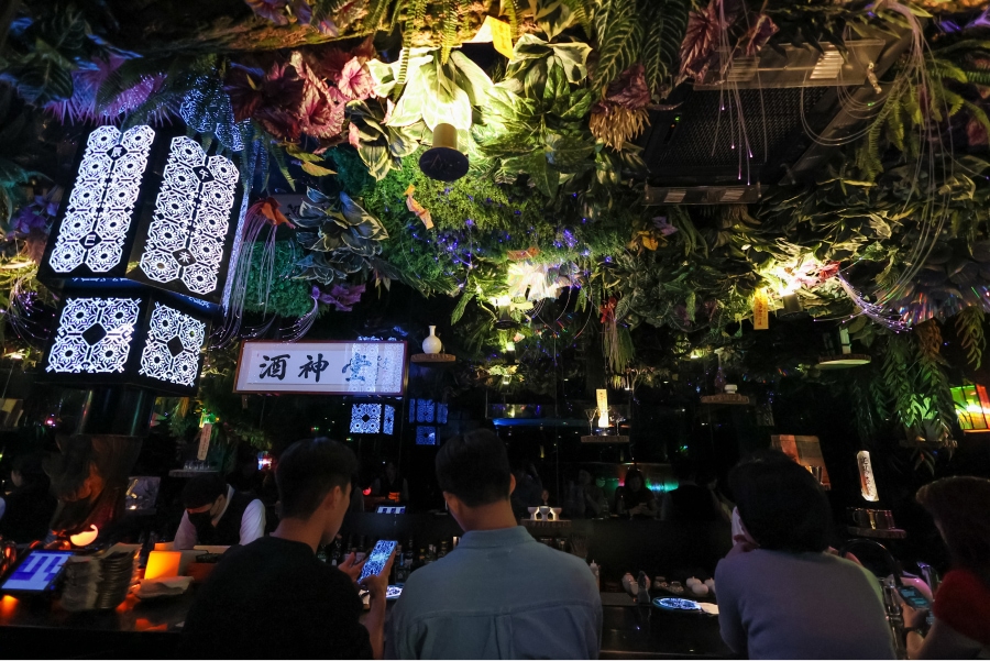 A table bar inside the main hall illuminated by dim light