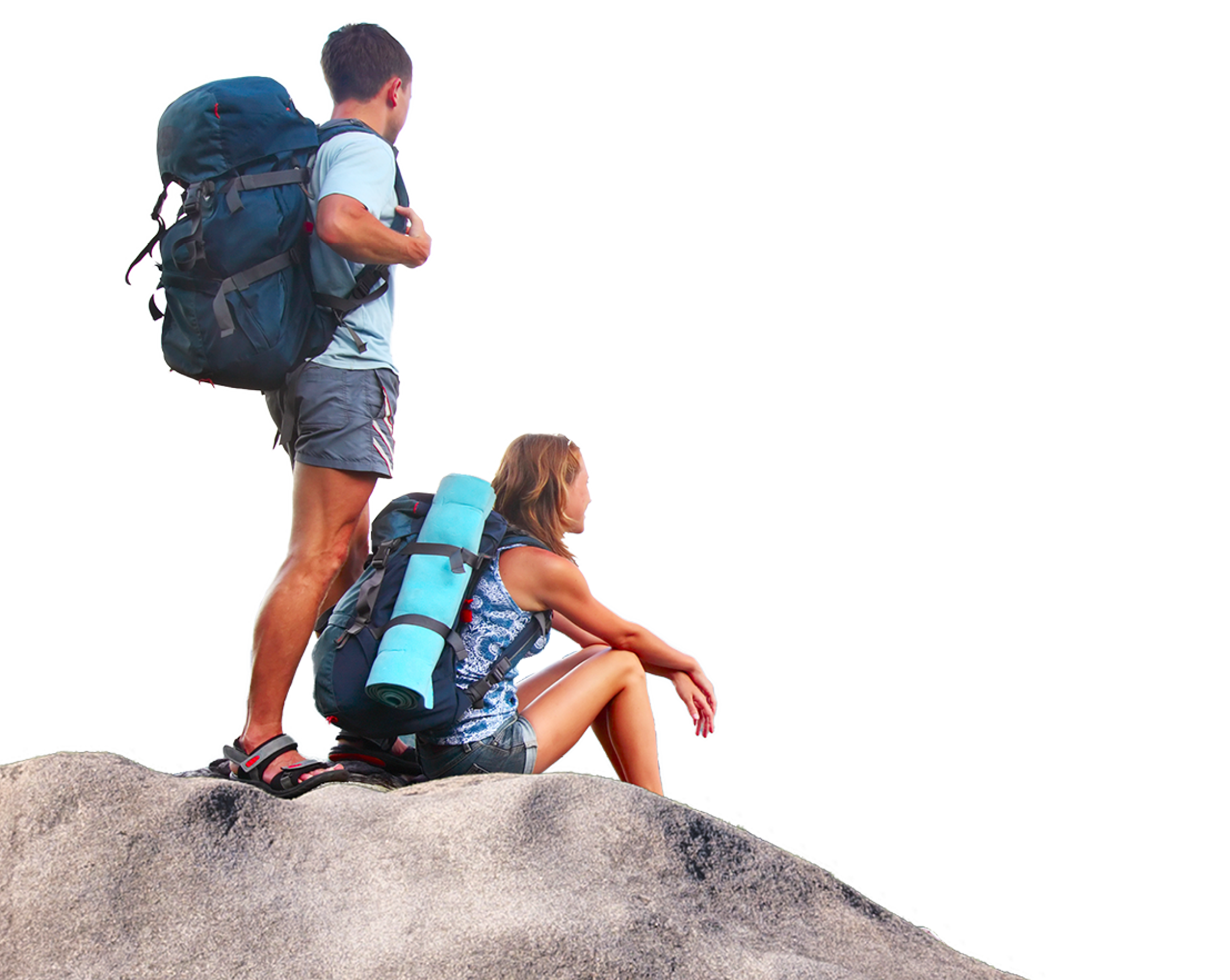 Young tourists with backpacks enjoying valley view from top of a mountain
